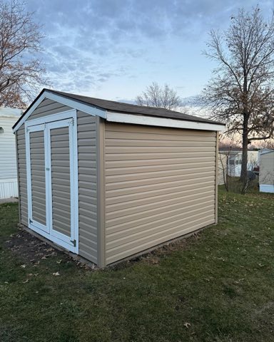 Storage shed with new siding
